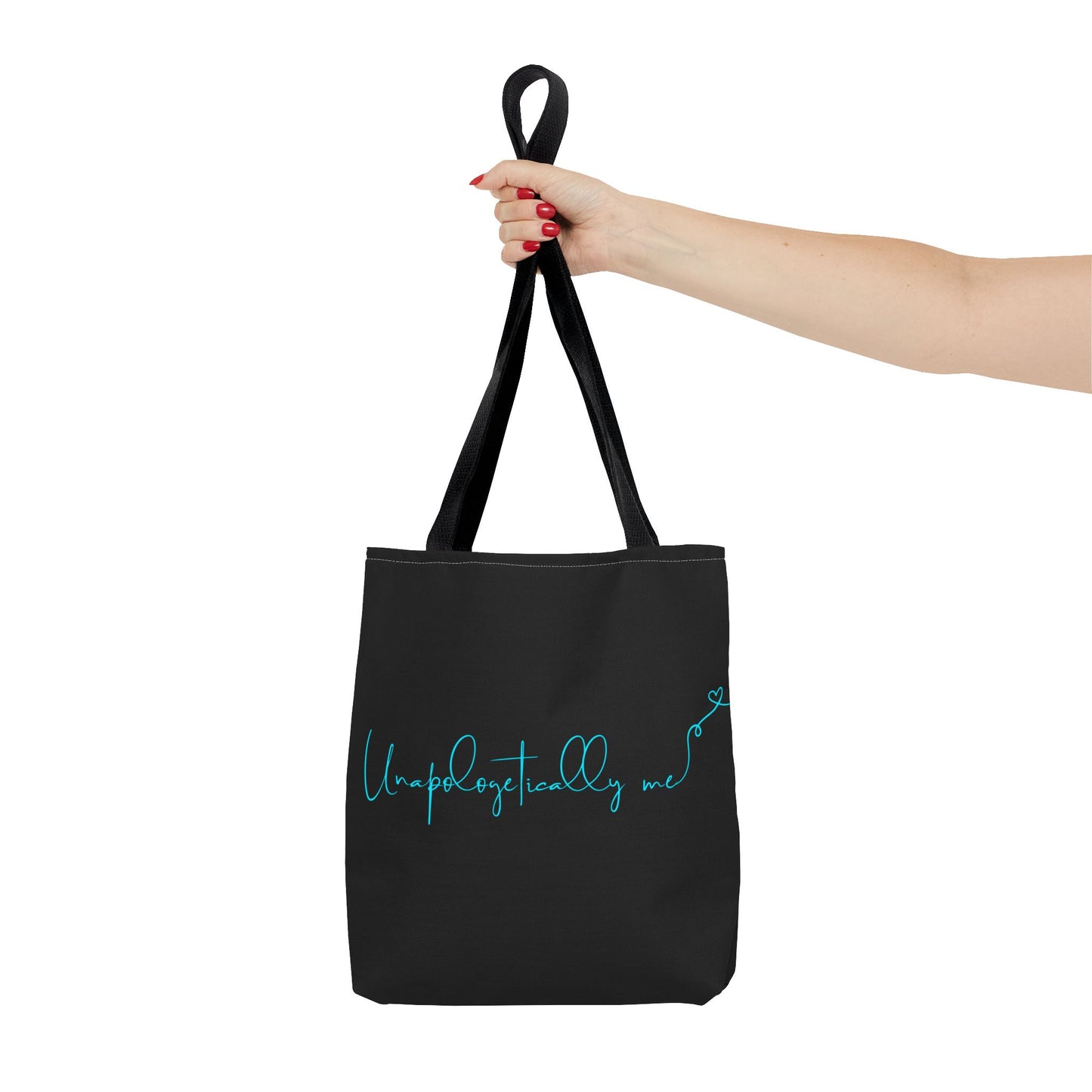 Woman carrying the Unapologetically Me tote bag, showcasing motivational design in teal.