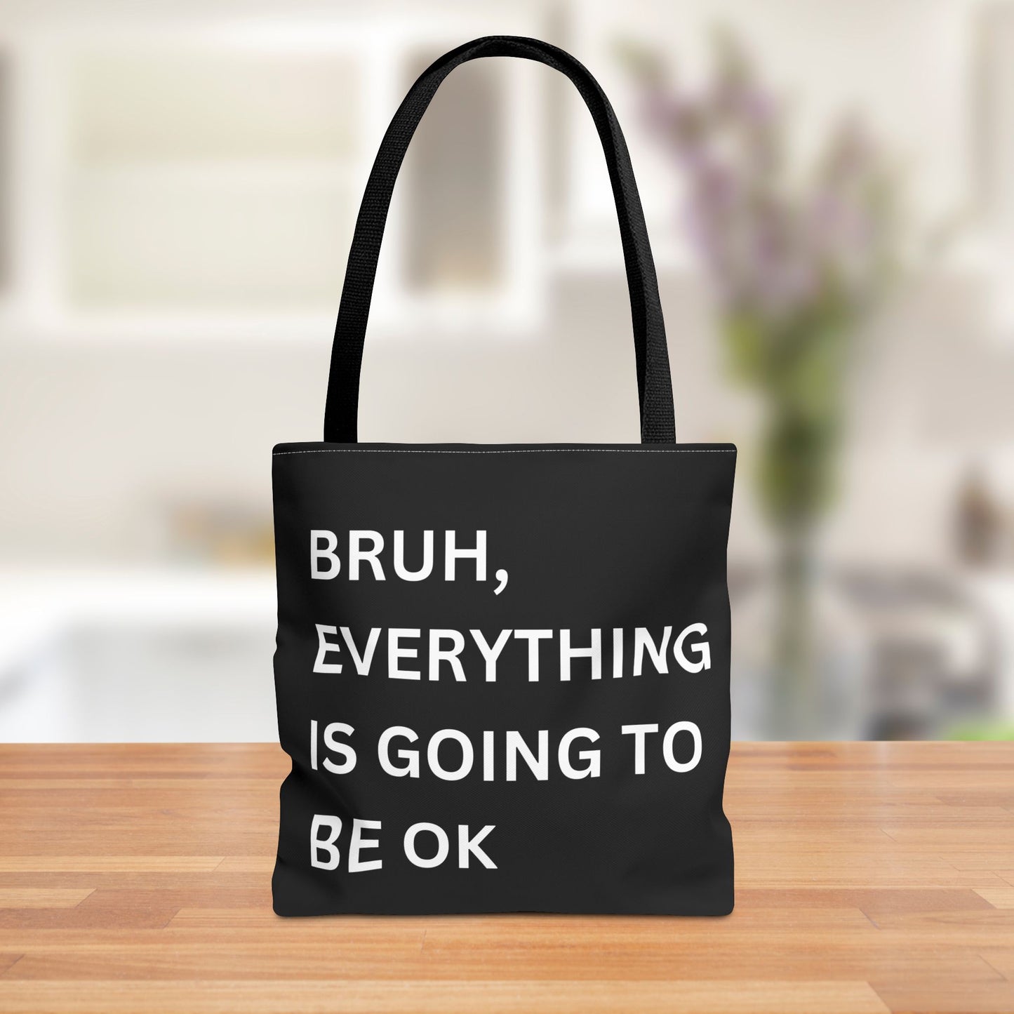 Front view of a minimalist tote bag featuring the quote "Bruh, Everything is Going to Be OK" in simple white text on a brown background.