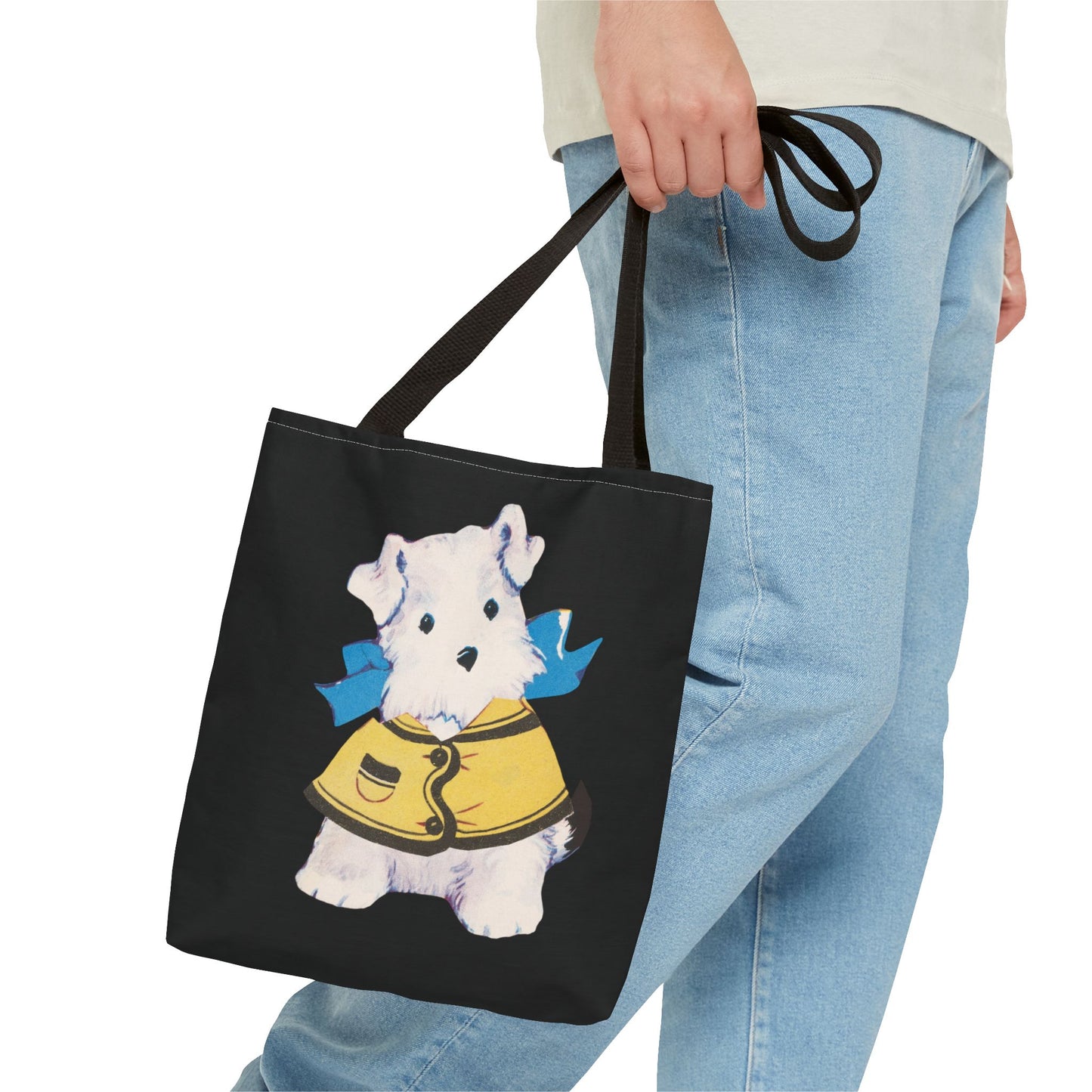 Close-up of the Bitsy puppy illustration on the tote bag, highlighting the intricate details of the yellow jacket and blue bow.