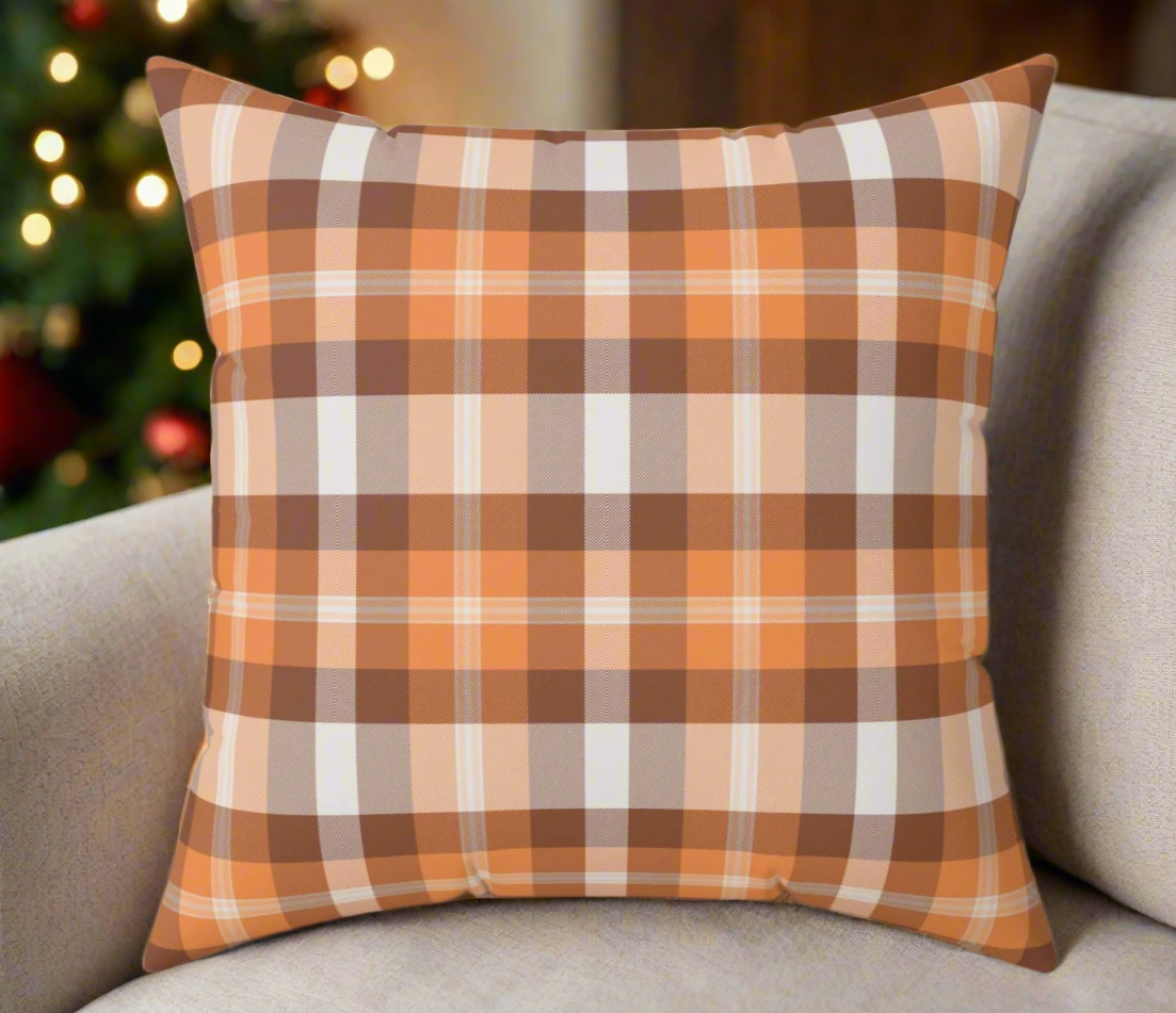 Back view of the accent pillow showing a cozy orange plaid pattern.