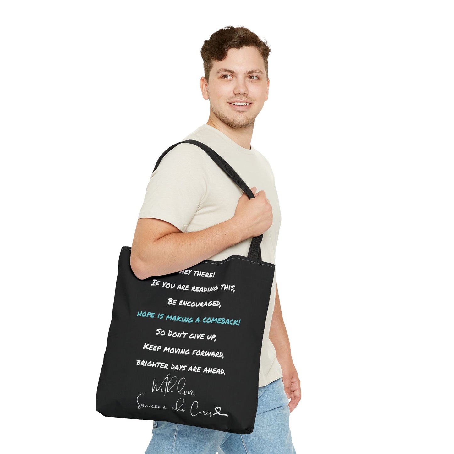 Close-up view of the motivational tote bag, showing the uplifting message "Hey There! If You Are Reading This, Be Encouraged, Hope is Making a Comeback!" with white and teal accents.