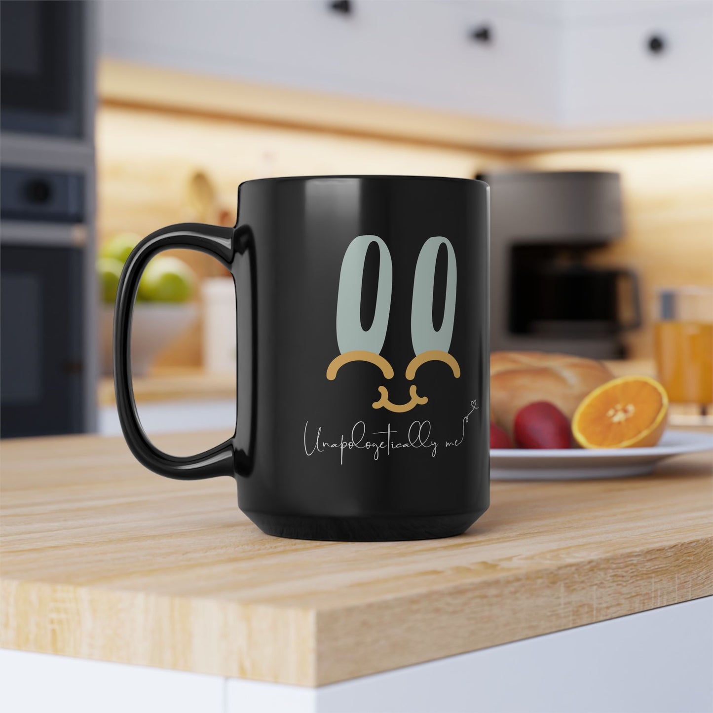 Black ceramic mug featuring a playful smiley face design and "Unapologetically Me" quote in cursive. 15oz