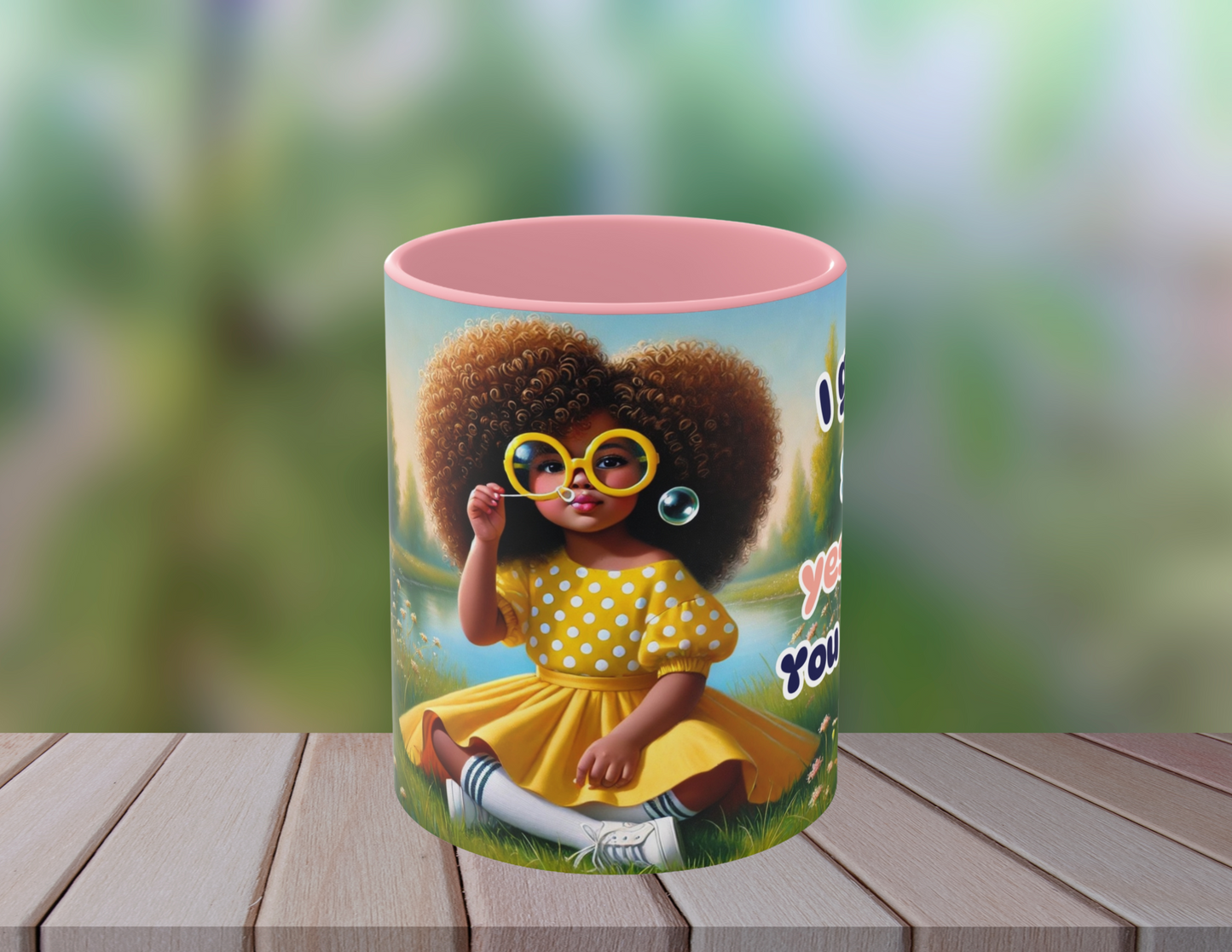 Close-up of a vibrant coffee mug with a sassy Afrocentric character wearing yellow polka dots and blowing bubbles.