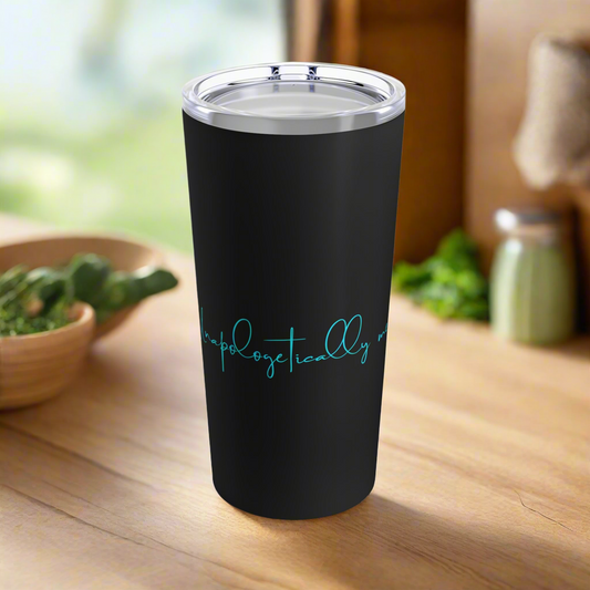 Front view of Unapologetically Me tumbler, black body with aqua script