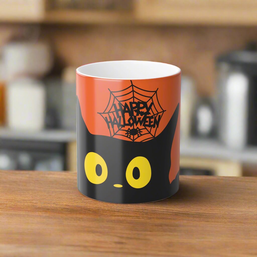Magic morphing Halloween mug with black cat design on an orange background, 11oz coffee cup