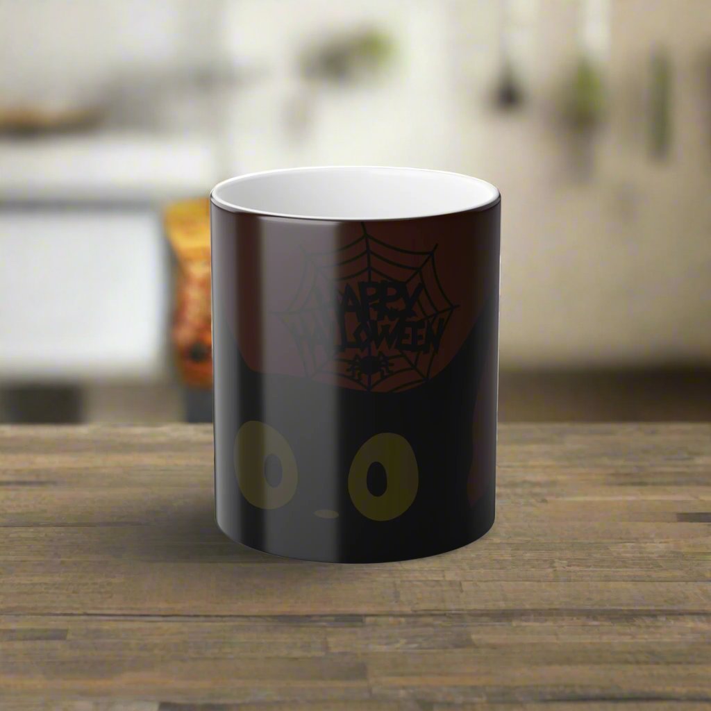 Magic morphing Halloween mug with black cat design on an orange background, 11oz coffee cup