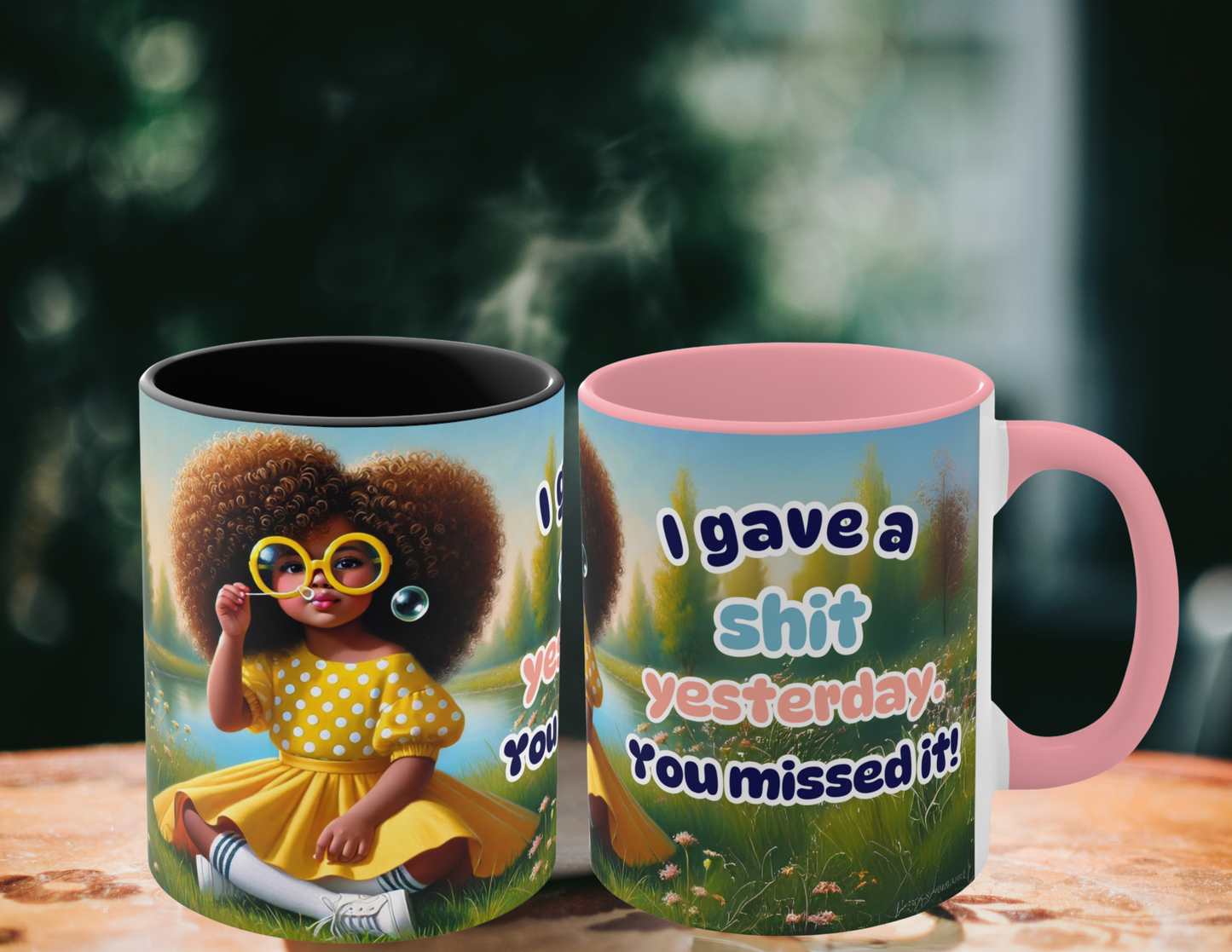 Coffee mug with humorous text "I gave a sh*t yesterday. You missed it!" and Afrocentric art, featuring a whimsical meadow background.