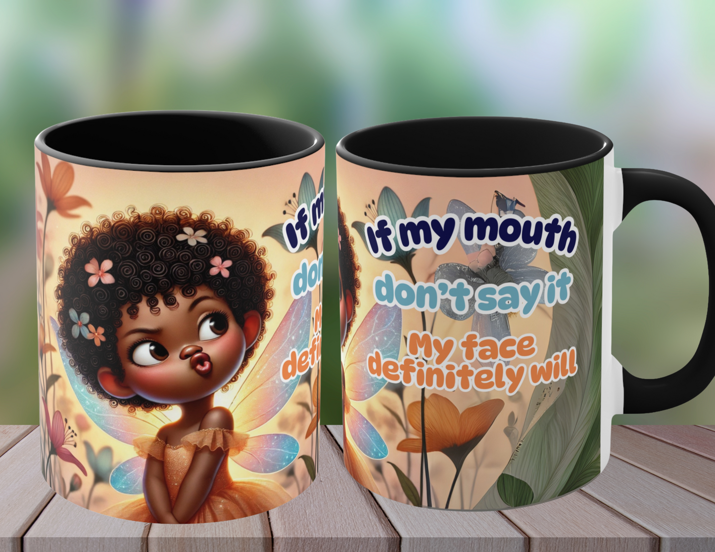 Two vibrant coffee mugs with a whimsical fairy design. The text on the mug reads "If my mouth doesn’t say it, my face definitely will." with colorful floral patterns and an expressive fairy character. The mugs are placed outdoors on a wooden table, surrounded by a natural, green, blurry background