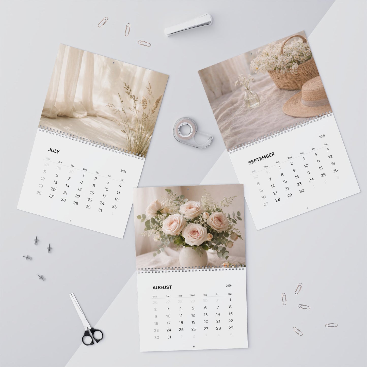 Three calendar pages showing different images on a light gray background with office supplies.