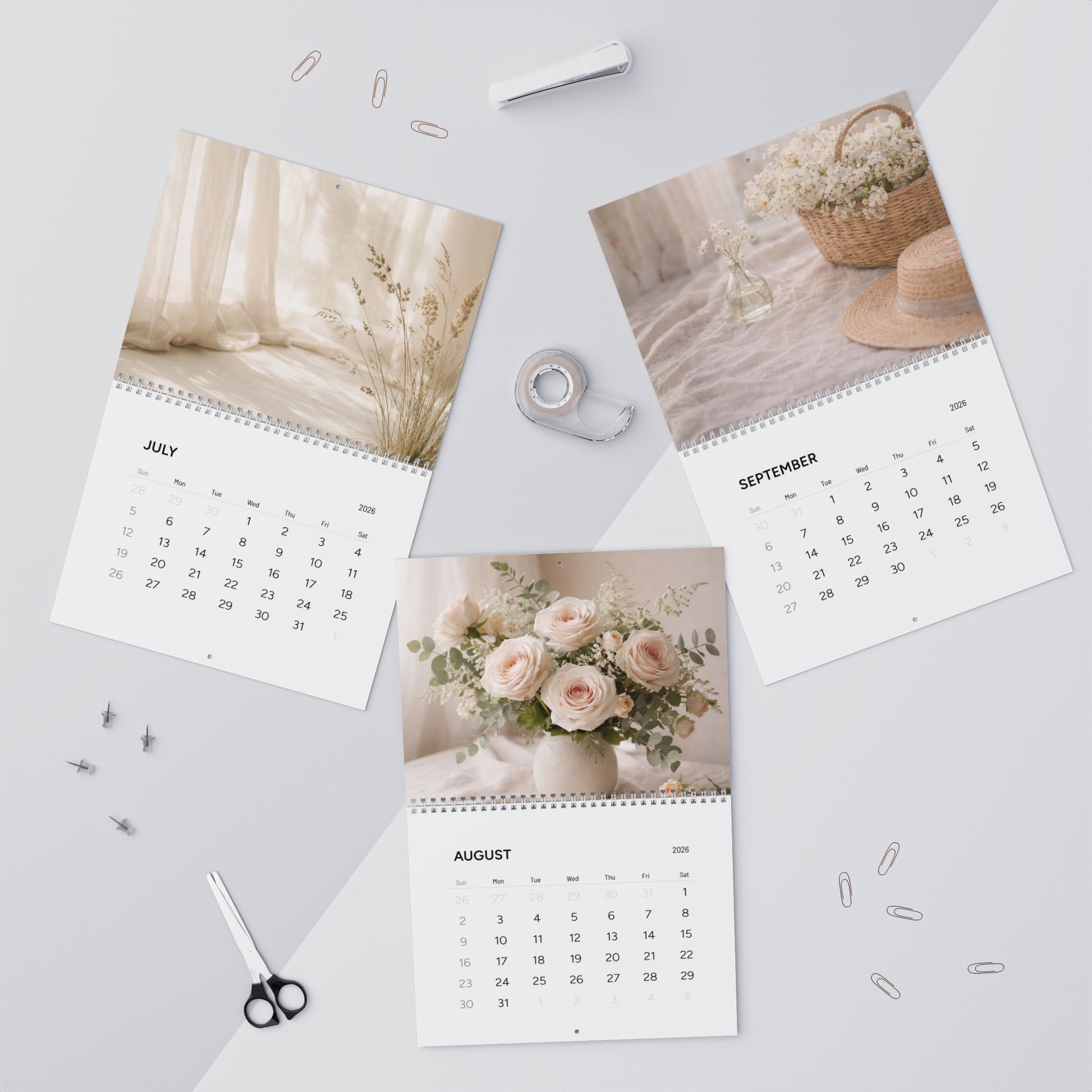 Three calendar pages showing different images on a light gray background with office supplies.