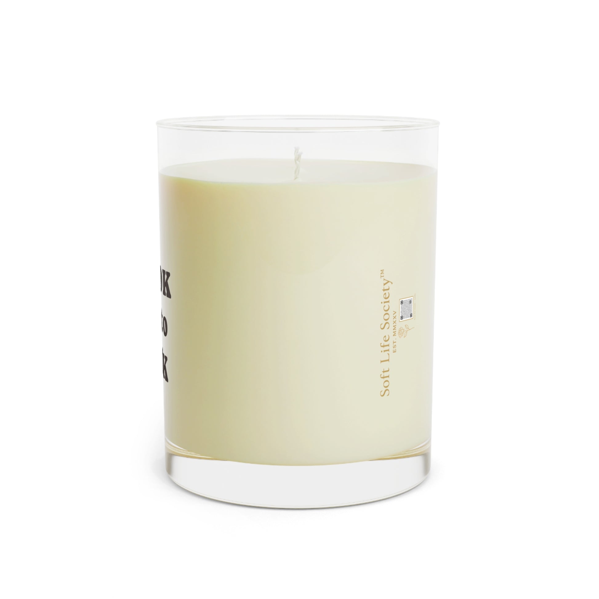 Candle with a Soft Life Society logo on a white background