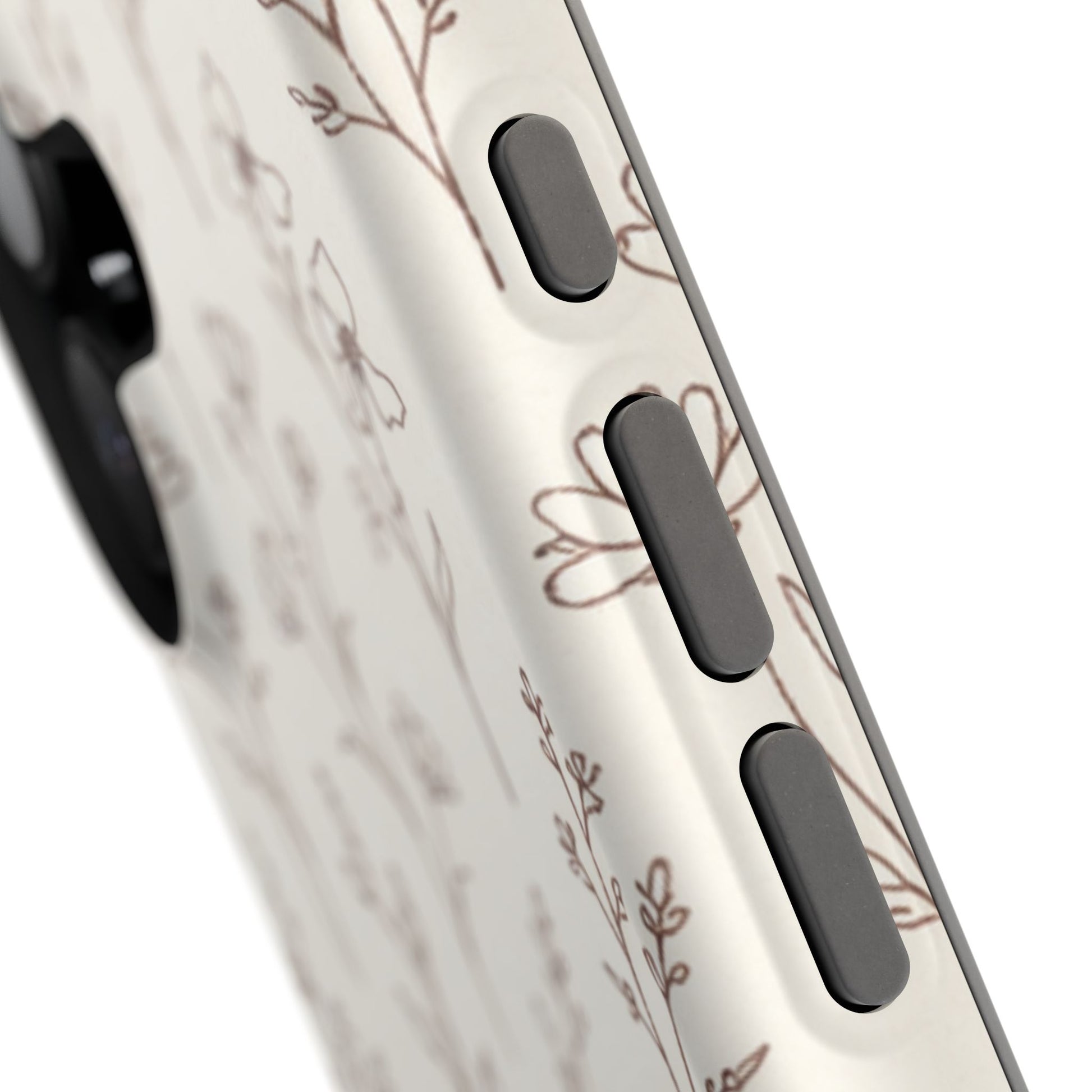 Close-up of a phone case with floral design and black buttons on a white background