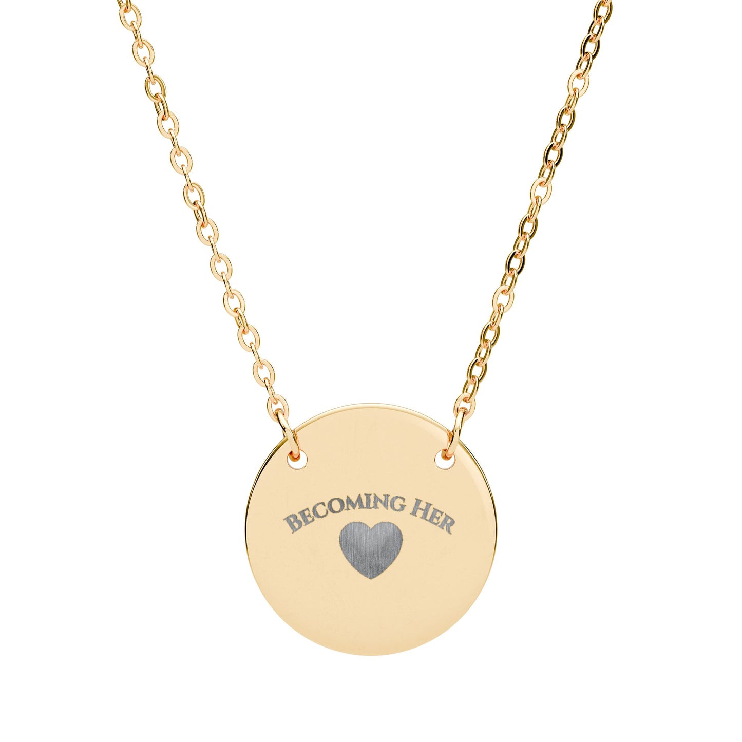 Gold necklace with a round pendant engraved with 'Becoming Her' and a heart symbol on a white background.
