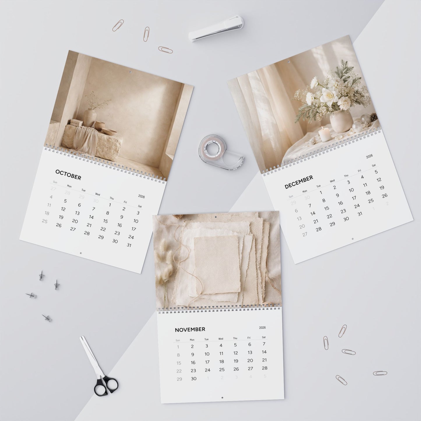 Calendar with images of a room and flowers on a light gray surface.