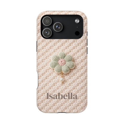 Phone case with a knitted pattern and a flower charm on a white background