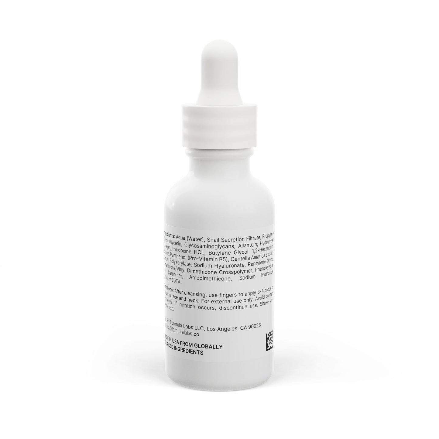 White dropper bottle with ingredient text on a white background