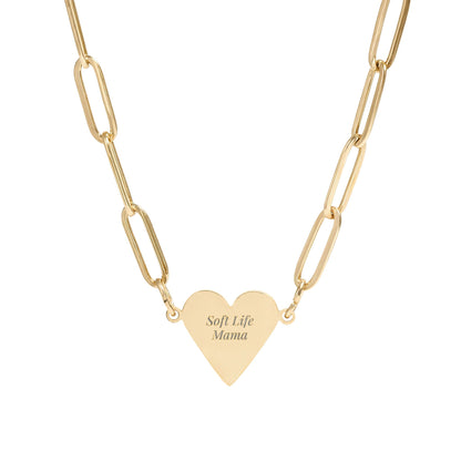 Gold heart-shaped pendant necklace with 'Soft Life Mama' engraving on a white background