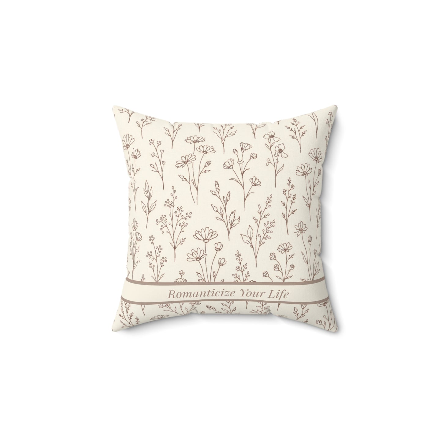 Decorative pillow with floral pattern and text on a white background