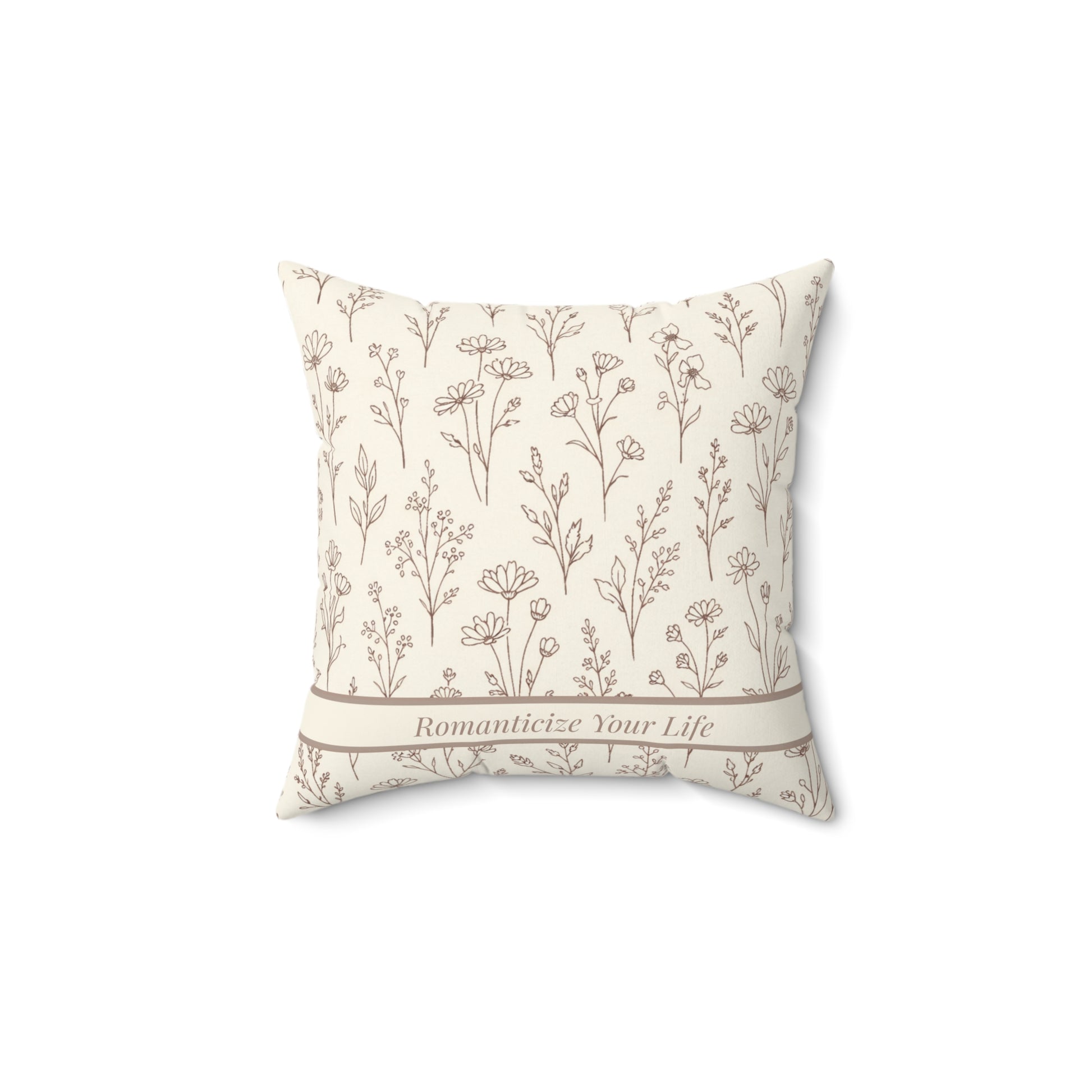 Decorative pillow with floral pattern and text on a white background