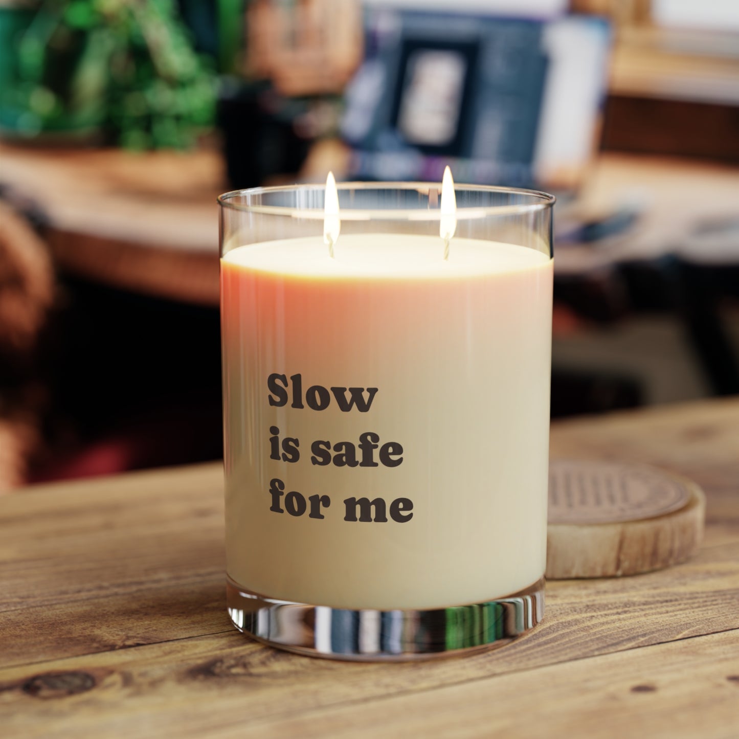 Soft Life Society Affirmation Candle with 'Slow is safe for me' text on a wooden surface
