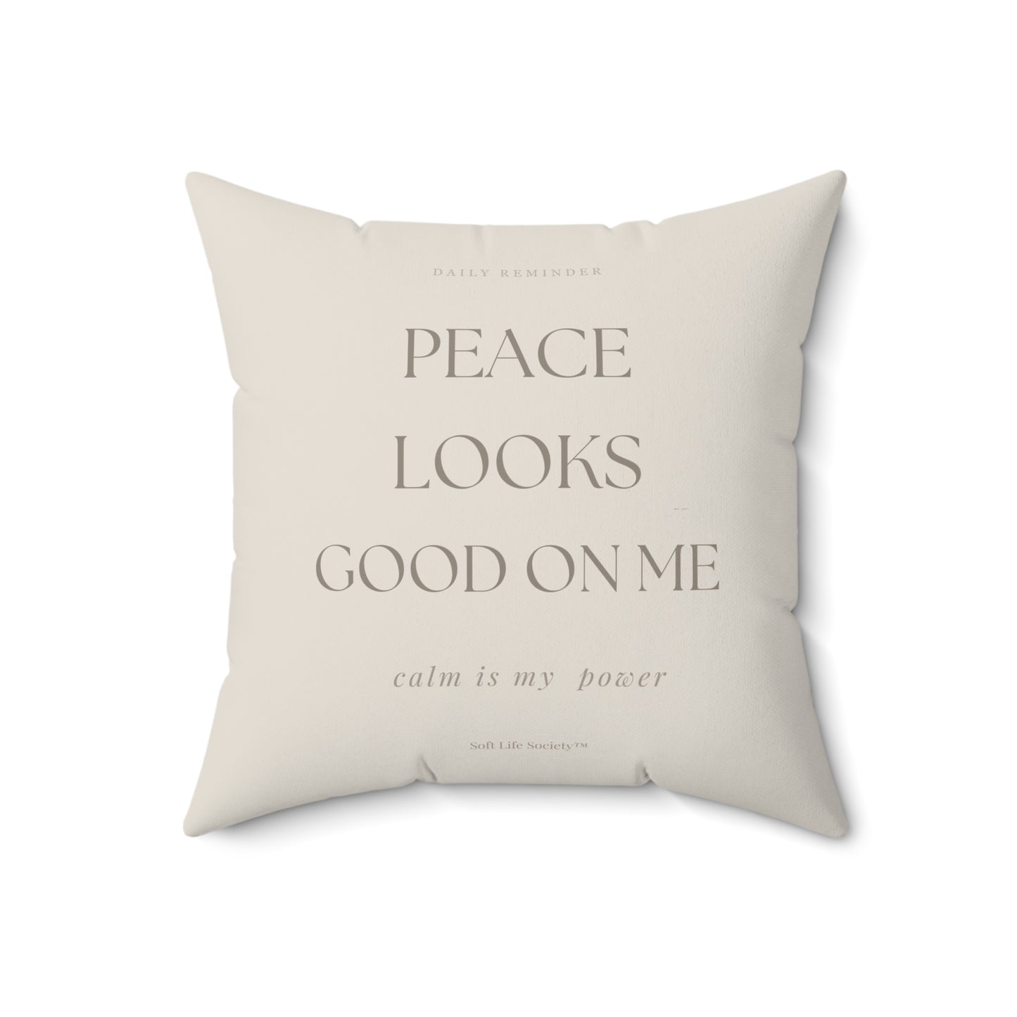 Beige pillow with text on a white background