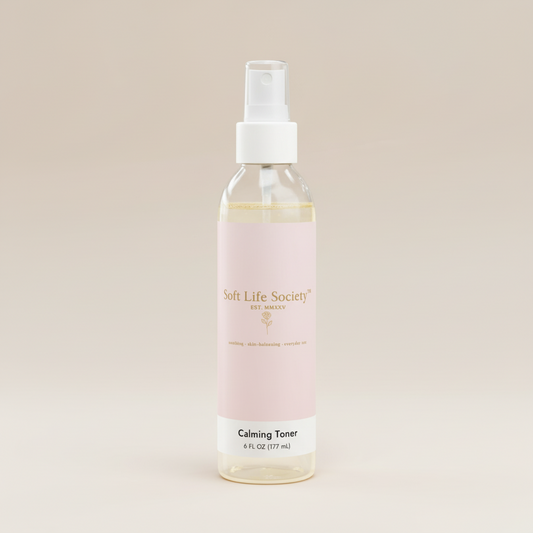 Bottle of Soft Life Society Calming Toner on a beige background