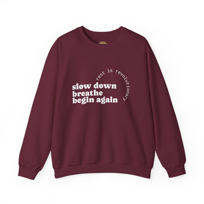 Maroon sweatshirt with motivational text on a white background