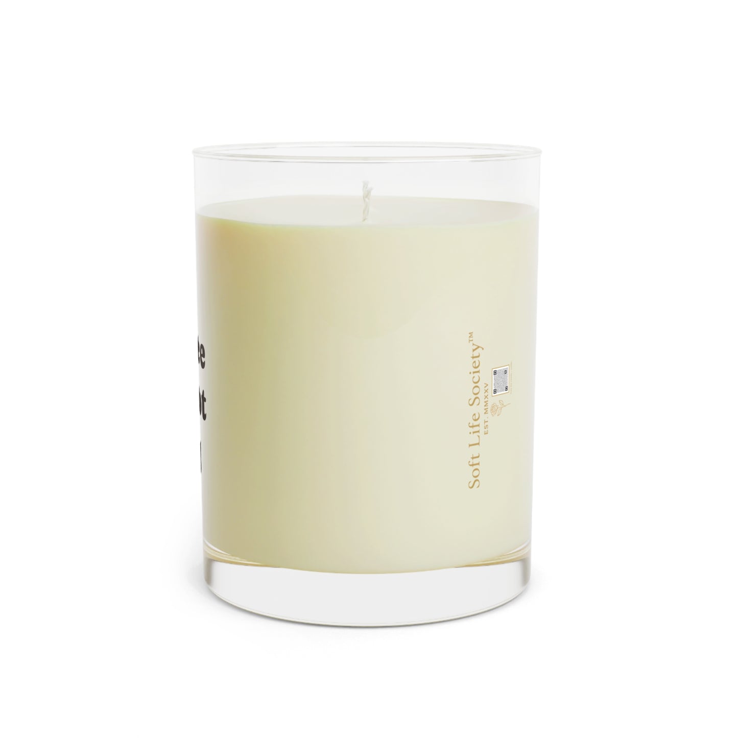 Candle with a Soft Life Society label on a white background