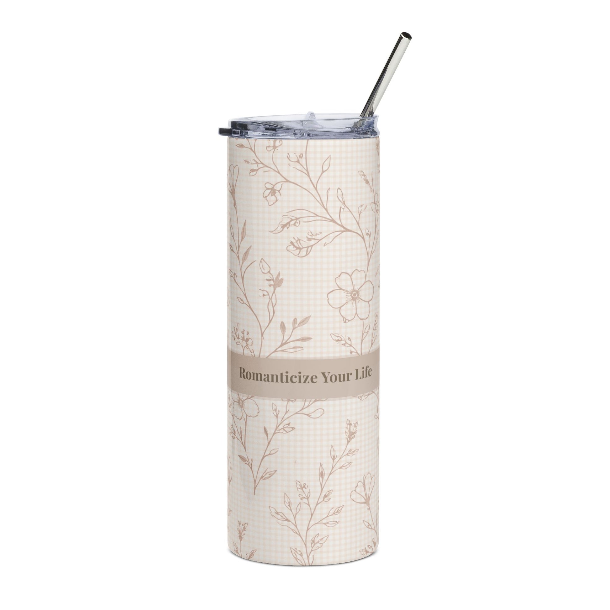 Tumbler with floral pattern and straw on a white background