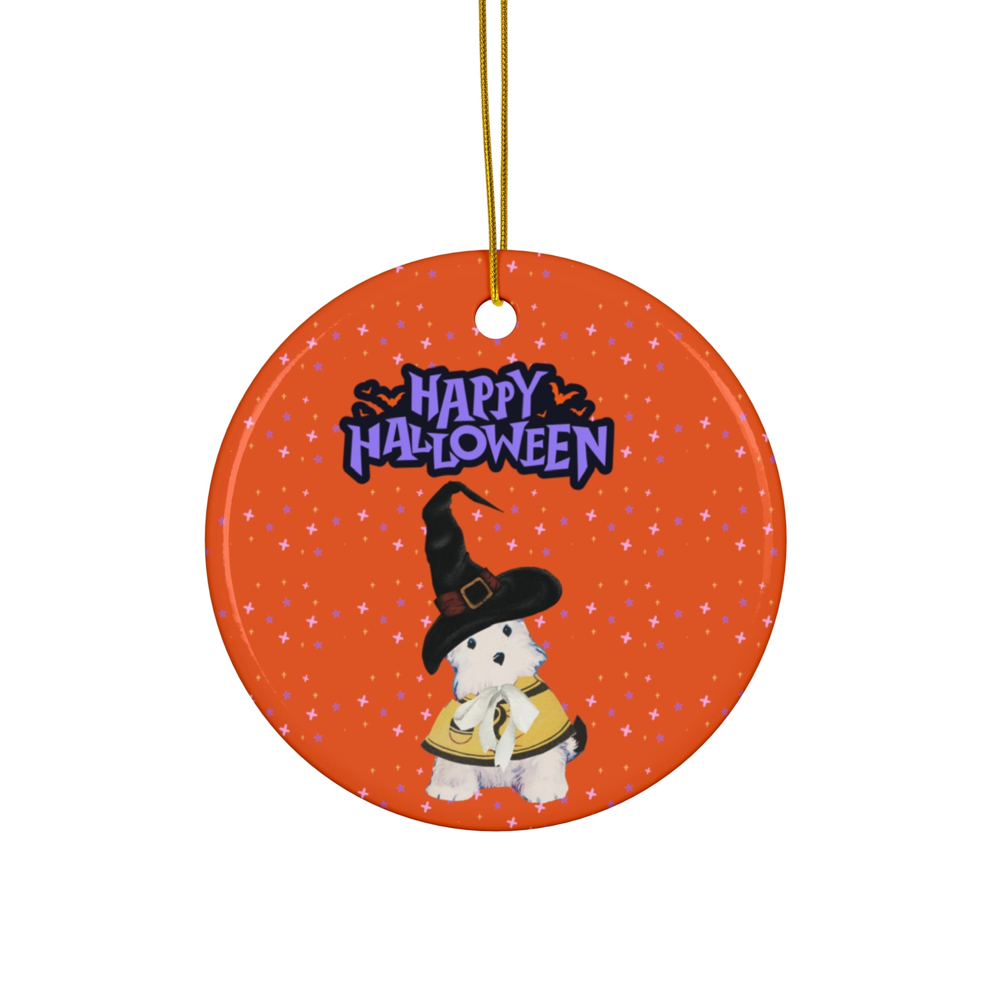 Round ceramic ornament with an adorable dog dressed as a witch and the text Happy Halloween, set against a vibrant orange background with stars.