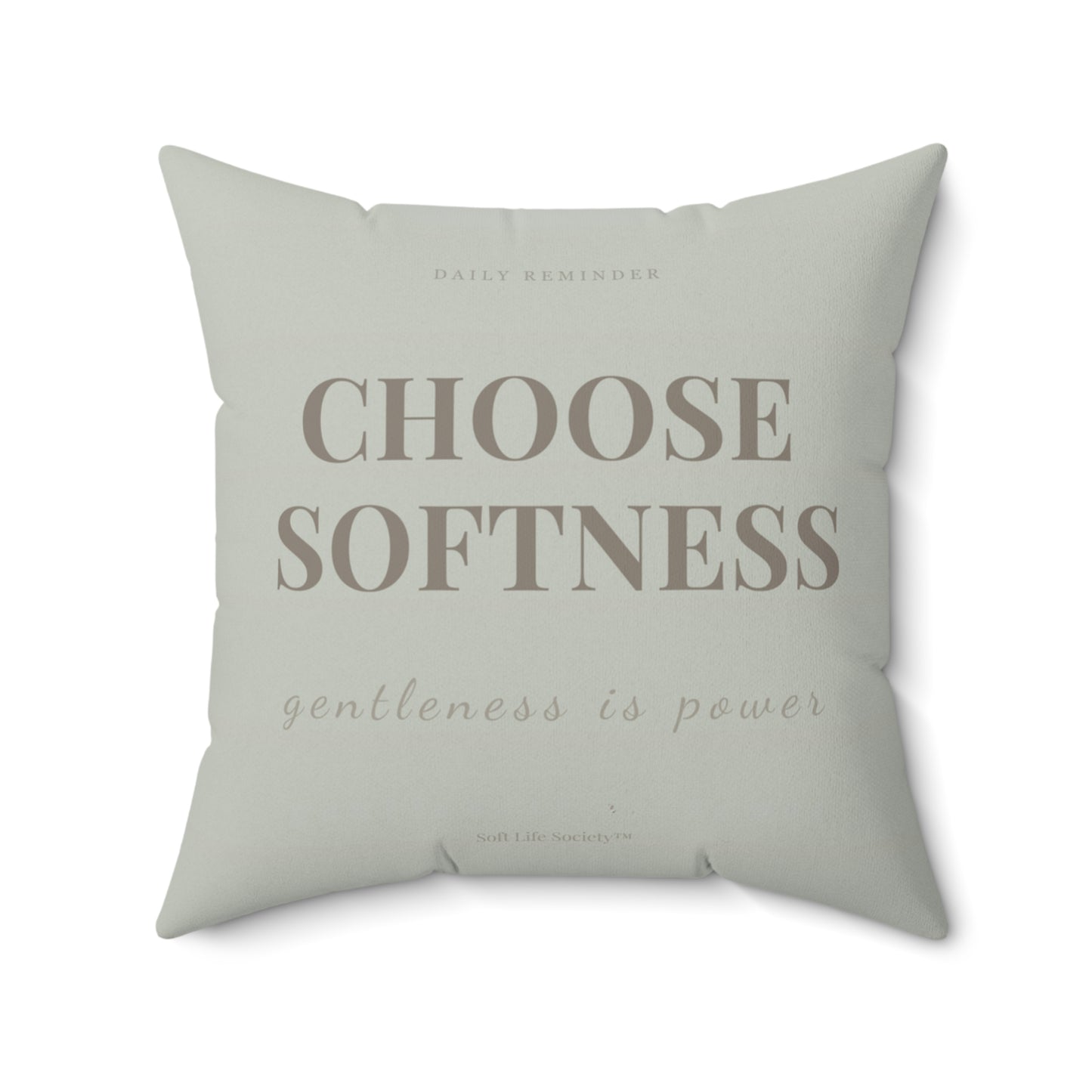 Sage green pillow with motivational text on a white background