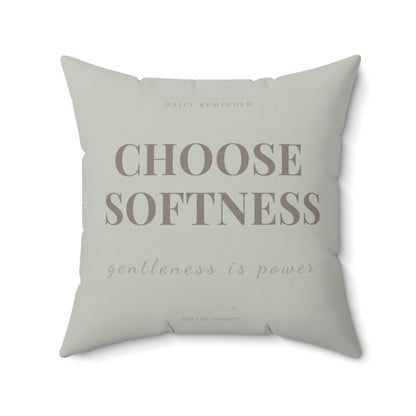 Sage green pillow with motivational text on a white background