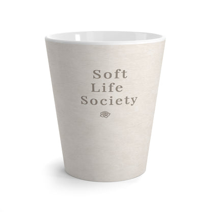 Cream ceramic cup with 'Soft Life Society' text on a white background
