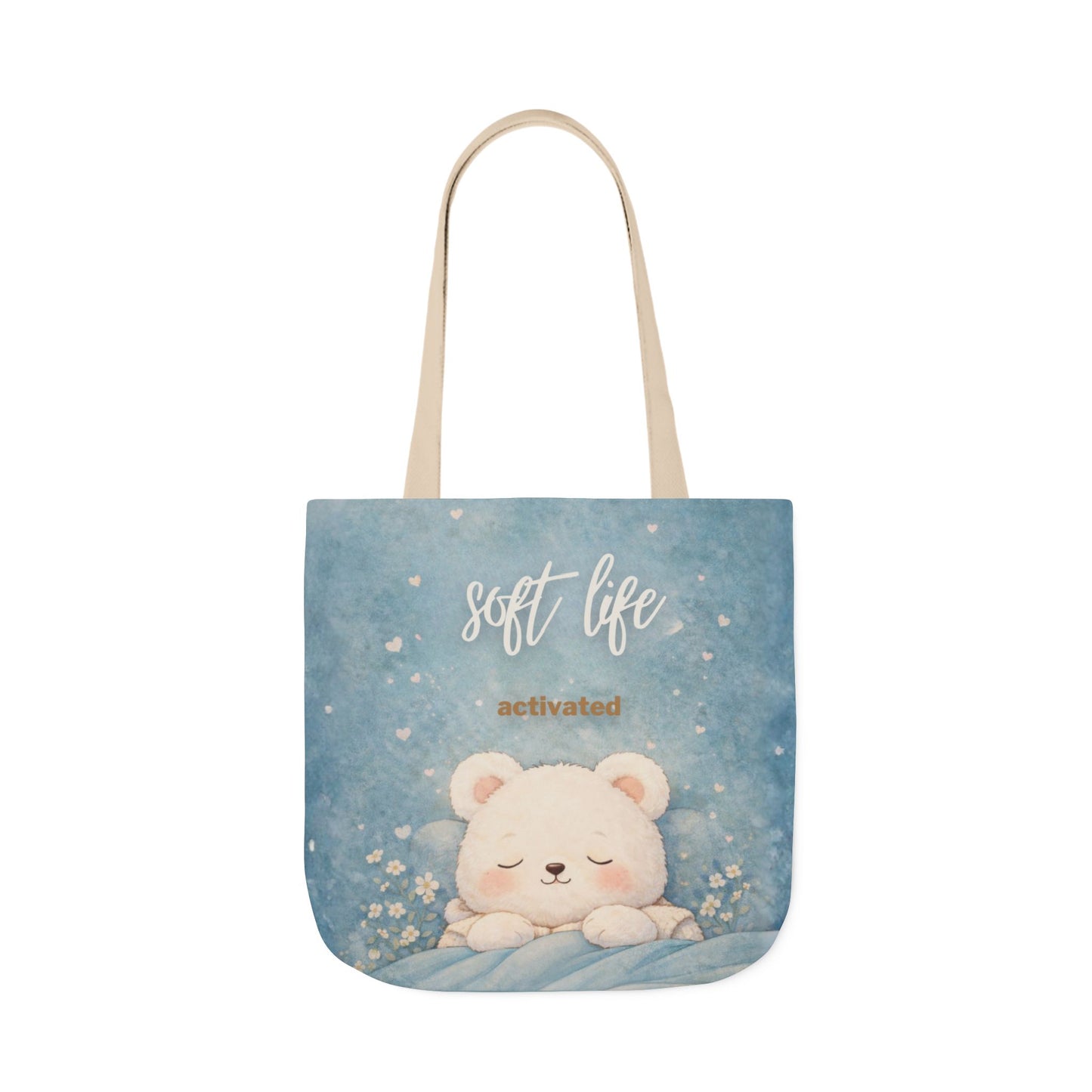 Tote bag with a bear illustration and 'soft life activated' text on a blue background