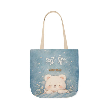 Tote bag with a bear illustration and 'soft life activated' text on a blue background