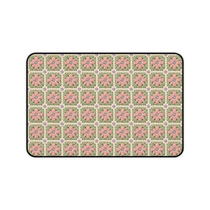 Patterned doormat with pink flowers on a white background