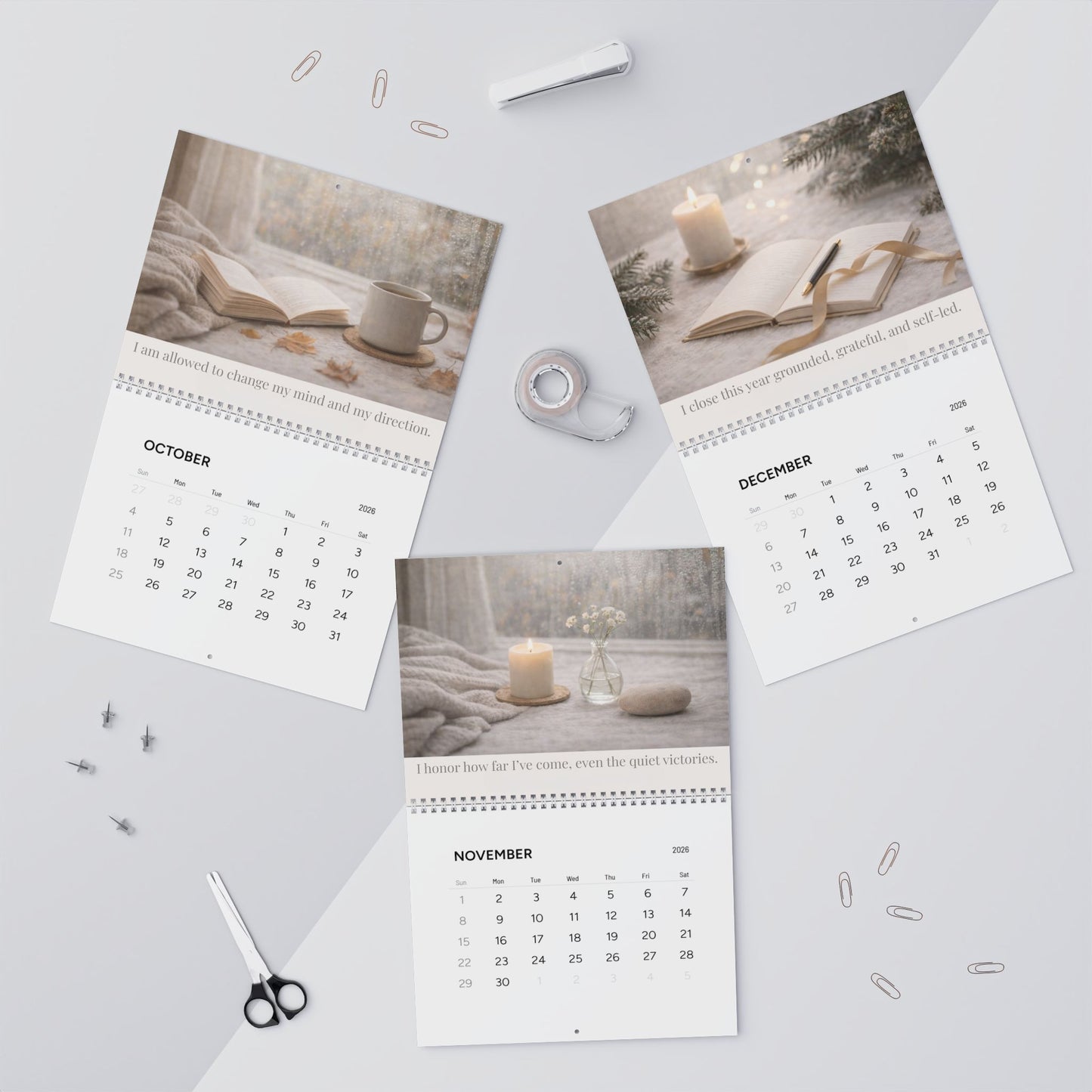 Three pages of a calendar showing October, November, and December on a light gray background.
