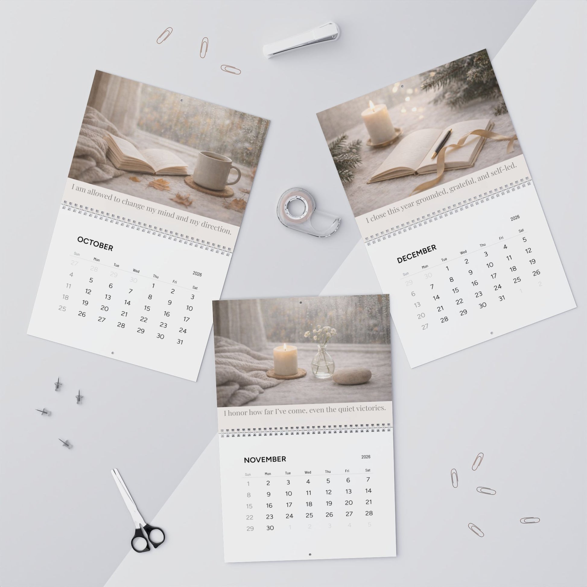 Three pages of a calendar showing October, November, and December on a light gray background.