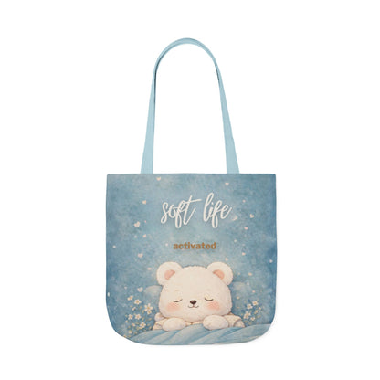 Tote bag with a bear design and 'soft life activated' text on a blue background
