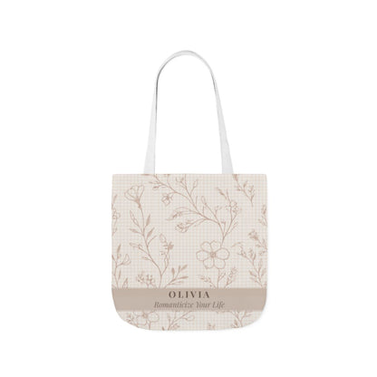 Tote bag with floral pattern and 'Olivia' branding on a white background