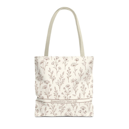 Tote bag with floral pattern and text on a white background