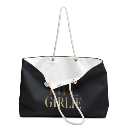 Soft Life Girlie weekender bag shown open to reveal the spacious white interior and rope handles.