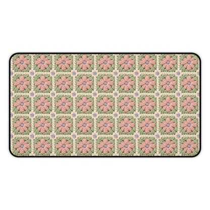Floral patterned doormat with pink flowers on a green background