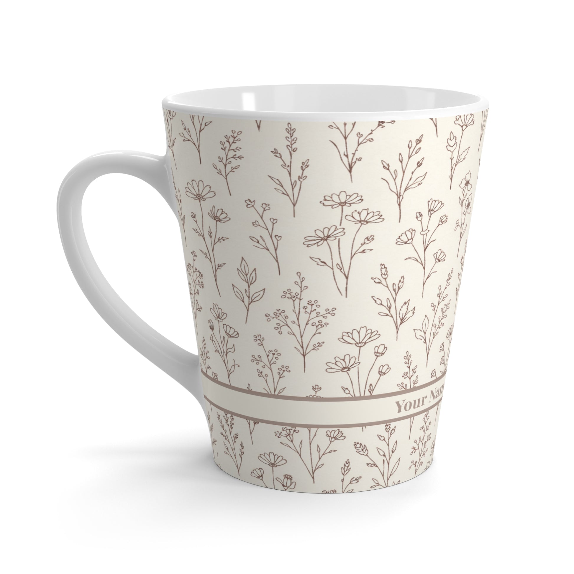 Side view of neutral botanical ceramic latte mug highlighting curved handle shape and wraparound floral pattern.
