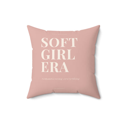 Pink pillow with 'SOFT GIRL ERA' text on a white background
