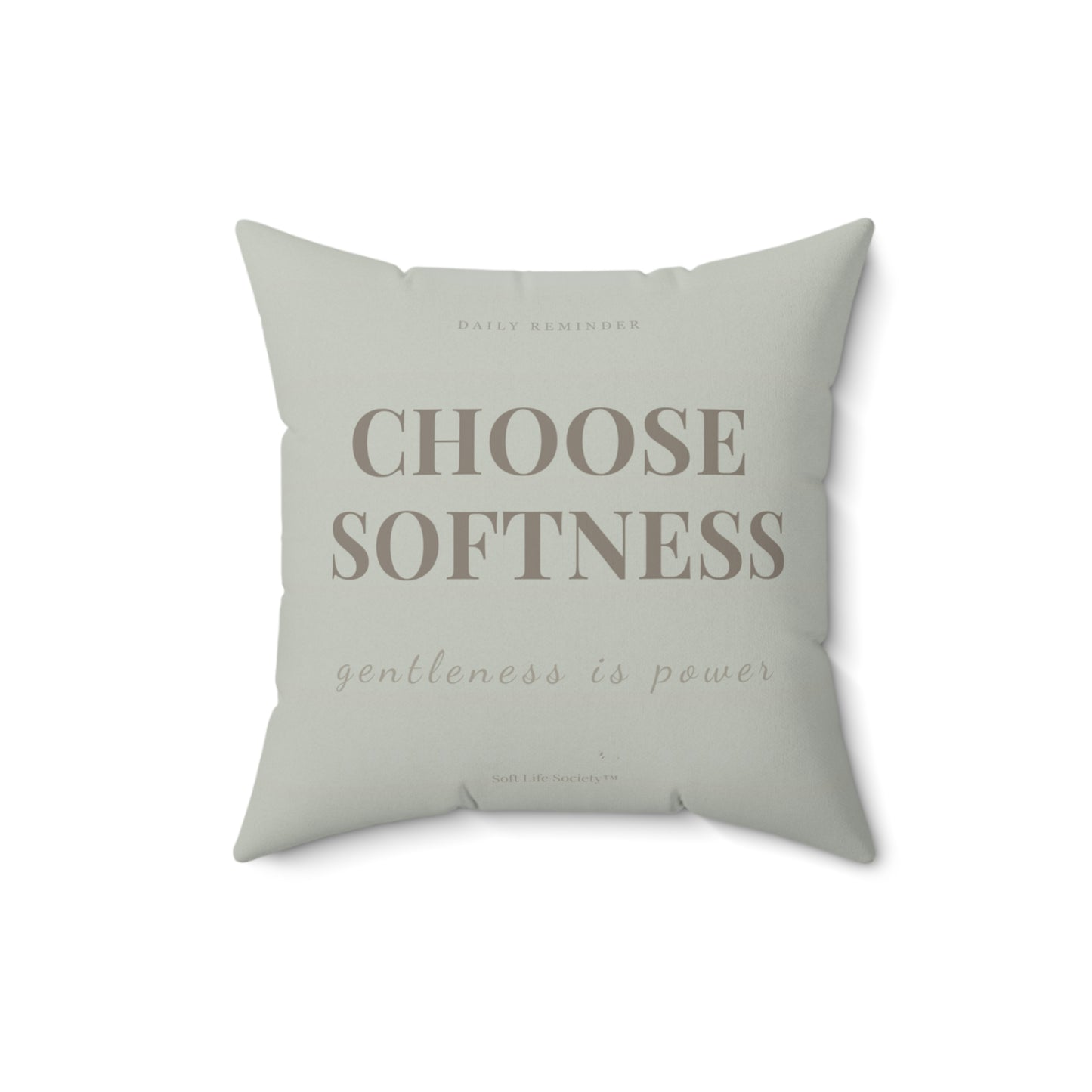 Light green pillow with text 'CHOOSE SOFTNESS gentleness is power' on a white background