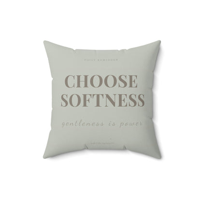 Light green pillow with text 'CHOOSE SOFTNESS gentleness is power' on a white background