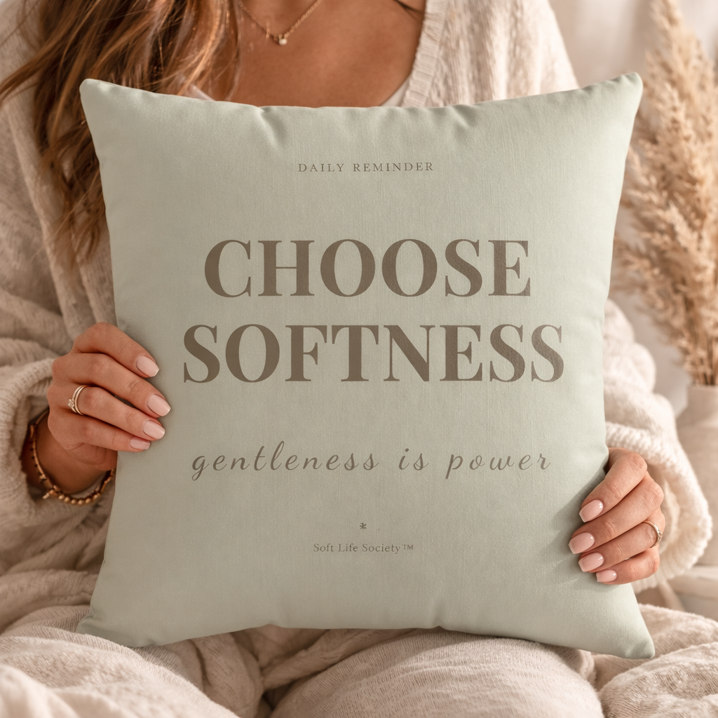 Person holding a pillow with 'Choose Softness, gentleness is power' text