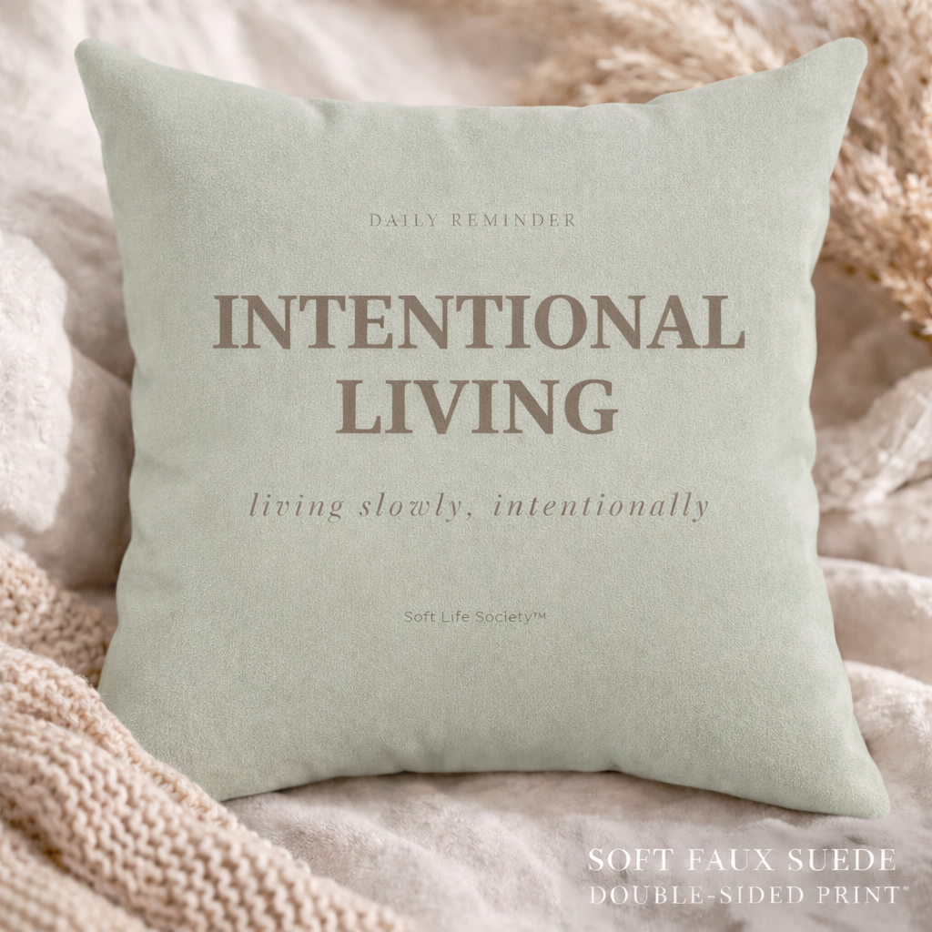 Light green pillow with 'Intentional Living' text on a soft background
