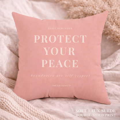 Pink pillow with text 'Protect Your Peace' on a soft background